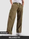 a man wearing cotton blend cargo pants featuring flap pockets, 