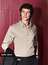 Man Wearing a clay beige "satin shirt for men" against a red background.